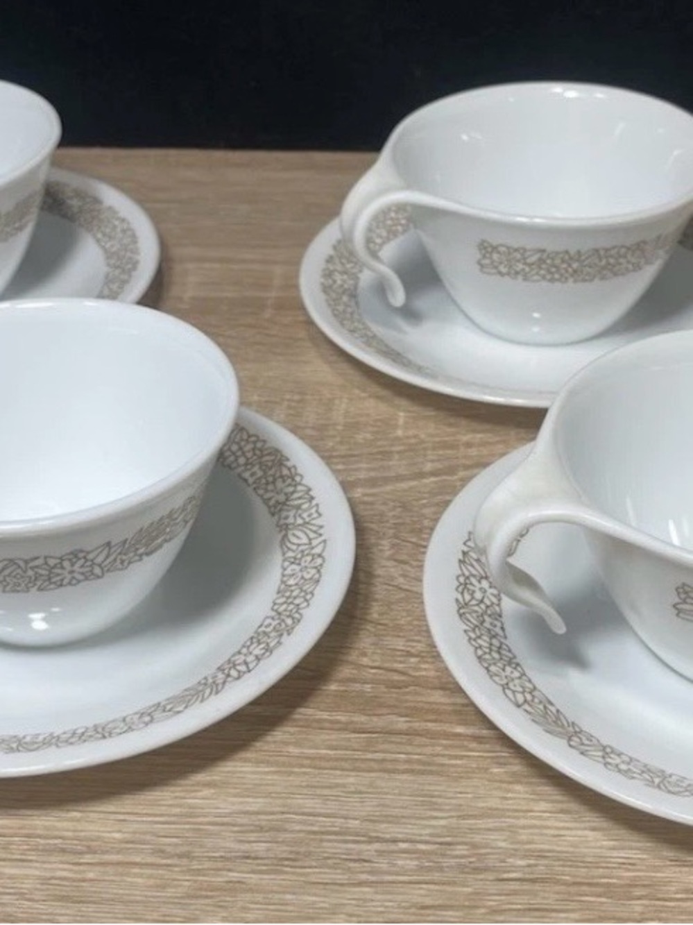 Set of (4) corelle pyrex coffe cups with saucers “woodland ” hook handles